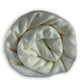 Miazi baby alpaca wool blanket – a soft, cream-colored blanket is neatly rolled and displayed against a plain white background, emphasizing its plush texture and gentle folds