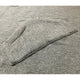 A gray wool sweater is folded neatly; its sleeve overlapping the main body, set against a matching textured background.