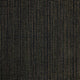 Zampu thick llama wool hooded poncho – a textured fabric features a grid pattern of small, evenly spaced, golden dots on a dark background, creating a rhythmic, geometric design