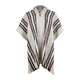 A wool poncho hangs, featuring a hood and button, adorned with vertical black, red, and white stripes. The background is plain, emphasizing the garment's texture and pattern.