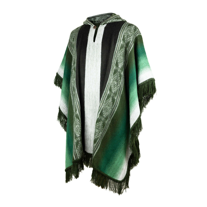 A green and white poncho with intricate geometric patterns drapes elegantly. It features a hood and fringe at the edges, displayed against a plain white background.