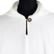 A white wool garment is displayed on a mannequin, featuring a buttoned closure at the neck. The background is plain to emphasize the garment's texture and design.