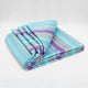 Tzacantza baby alpaca wool blanket – a folded blanket displays a pattern of blue, pink, and green stripes, situated on a plain white background