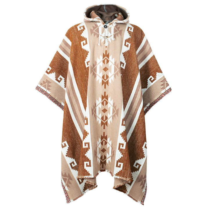 A hooded poncho displays geometric patterns in shades of brown and beige, with traditional designs and frayed edges, hanging against a plain white background.