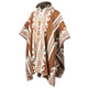 Poncho with a hood, displaying a geometric pattern in brown, beige, and white colors, hangs against a white background. The edges have intricate border designs and button details.