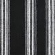 Black fabric displays vertical stripes in shades of grey and white, creating a textured, patterned design. The alternating colors enhance depth and contrast in a woven appearance.