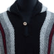 A knitted sweater features thick, vertical stripes in black, gray, and maroon. It has a buttoned collar and a hood visible, displayed on a black mannequin torso.
