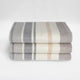 Yankuam baby alpaca wool blanket – folded blankets with horizontal stripes in gray, beige, and cream, stacked on top of each other against a plain white background