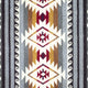 Geometric pattern displaying zigzag and diamond motifs in red, maroon, brown, and white on a gray striped fabric with swirling black and white designs along the edges.
