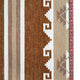 Textile features a pattern with geometric designs, including brown stripes, zigzag motifs, and arrowheads. A pink and black diamond border accents the edge, creating a visually rich composition.