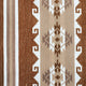 A woven fabric showcases geometric patterns, including diamonds and angular shapes, in brown, beige, and white, set against a striped backdrop, evoking a Southwestern design.