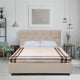 Quisapincha baby alpaca wool blanket – a bed with a tufted headboard is in a bedroom. It has white pillows and a striped blanket. The room includes a chair, wall art, hanging lights, and plants