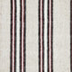 Patterned fabric with vertical stripes; alternating thick black, white, and thin red lines. The texture suggests a woven material, creating a rustic, traditional appearance.