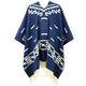 A blue poncho with white geometric patterns and fringed edges is displayed against a white background. The intricate designs include lines and square motifs, creating a traditional aesthetic.