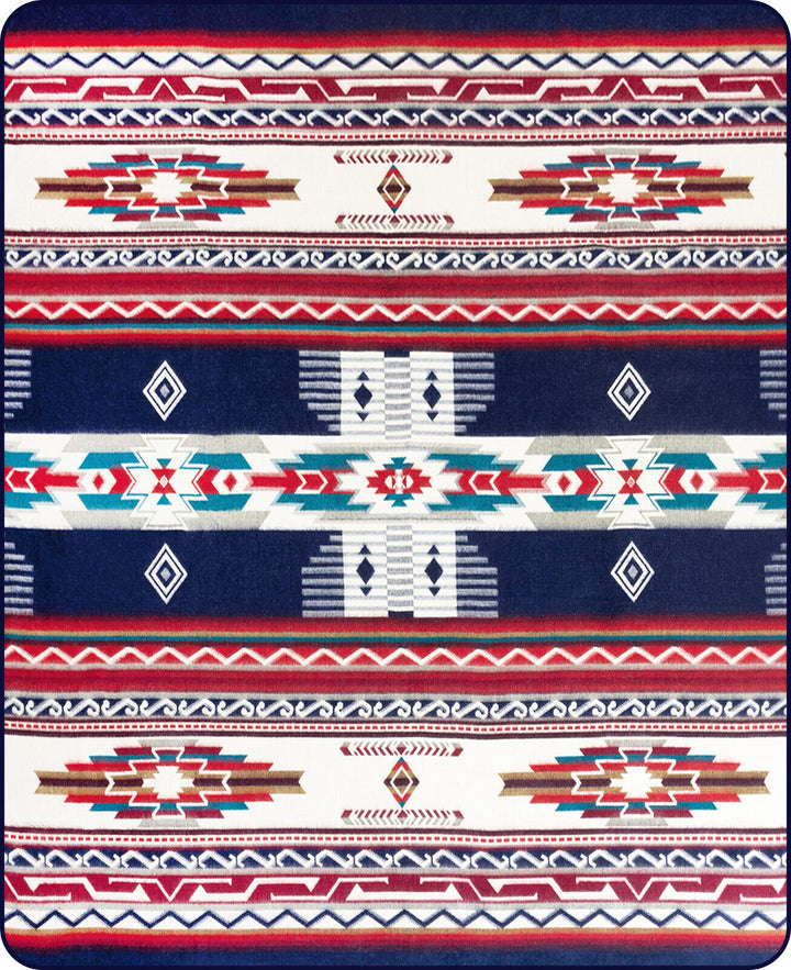 Geometric pattern features bold, colorful zigzags, diamonds, and stripes in red, blue, and white, creating a vivid tapestry design.