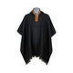 A dark gray poncho with fringe details, featuring an embroidered orange and yellow collar with a button closure, displayed against a plain white background.