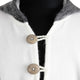 White coat with two large, round buttons fastening it. The collar is gray, and the coat is displayed on a black mannequin.