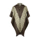 A woolen poncho hangs against a white background. It features geometric patterns in light and dark brown with a fringe hem and is fastened by two wooden buttons at the neck.