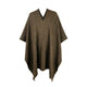 A brown, checkered poncho hangs with a V-shaped neckline, draping symmetrically. Set against a plain white background, its edges form soft, pointed tips. No text is present.