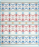 A patterned fabric displays zigzag and diamond motifs in blue, red, orange, and gray, arranged in horizontal stripes. The design is repeated symmetrically on a white background.