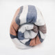 Sopoto baby alpaca wool blanket – a rolled-up woolen blanket with wide horizontal stripes of blue, white, and orange, lies against a plain white background