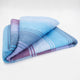 Tinizaray baby alpaca wool blanket – a folded blanket displays a gradient of blue, purple, and pink with plaid patterns, resting on a plain, light background