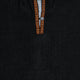 Shirt with a dark fabric features a decorative button placket. The placket is adorned with a colorful geometric pattern in orange and yellow, providing contrast.