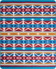 A woven textile displays symmetrical geometric patterns featuring zigzags, triangles, and diamonds. The design incorporates vibrant colors like turquoise, red, orange, and white, creating a bold, tribal-inspired aesthetic.